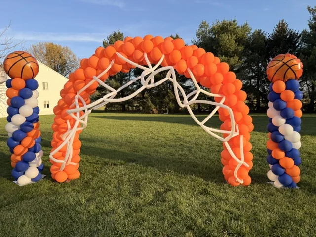Orange basketball balloon arch outdoors