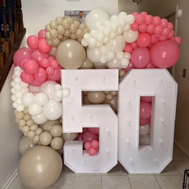 Pink, white and champagne 50th birthday balloons