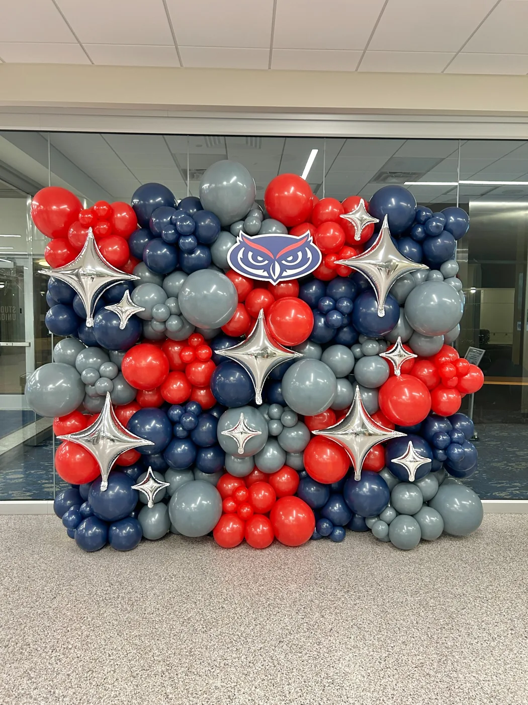 Red navy and silver themed balloon wall